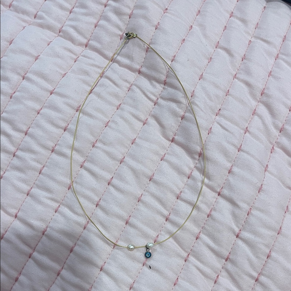 Elegant Gold Necklace with Pearl and Evil Eye Charm